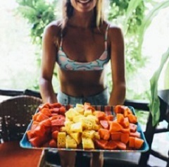 Person holding a fruit plate